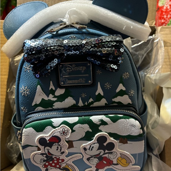 disney winter mini backpack LF Snow White Evergreen Dazzling in wintry pale blue sequins Loungefly Disney Mickey & Minnie